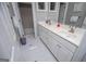 Bright bathroom with double sinks, white tile, and ample storage at 7003 Tara Dr, Villa Rica, GA 30180