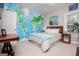 Bedroom features bright wallpaper, cozy bed, and charming windows at 7003 Tara Dr, Villa Rica, GA 30180