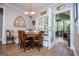 Inviting breakfast nook featuring built-in bench seating, a round table, and a view of the screened porch at 7003 Tara Dr, Villa Rica, GA 30180