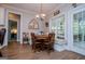 Cozy breakfast nook featuring built-in seating, a round wooden table, and access to a screened porch at 7003 Tara Dr, Villa Rica, GA 30180