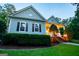 Beautiful home with a covered front porch, decorative shutters, and mature landscaping at 7003 Tara Dr, Villa Rica, GA 30180