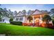 Charming home featuring a covered front porch, brick accents and a well-manicured lawn at 7003 Tara Dr, Villa Rica, GA 30180