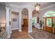 Stately foyer featuring hardwood floors, arched doorways, and classic architectural details at 7003 Tara Dr, Villa Rica, GA 30180