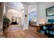 Expansive foyer with hardwood floors, arched doorways, and an open layout into other living spaces at 7003 Tara Dr, Villa Rica, GA 30180