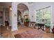 Grand foyer with hardwood flooring, arched entryways, and large windows providing natural light at 7003 Tara Dr, Villa Rica, GA 30180
