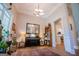 Cozy living room area with piano and view through archway into the kitchen at 7003 Tara Dr, Villa Rica, GA 30180
