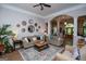 Spacious living room with stylish furniture, decorative mirrors, and an open layout at 7003 Tara Dr, Villa Rica, GA 30180