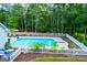 Inviting backyard featuring a sparkling pool with a diving board, perfect for summer fun and relaxation at 7003 Tara Dr, Villa Rica, GA 30180