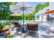 Inviting pool area with comfortable lounge chairs, umbrellas, and well-maintained landscaping for outdoor enjoyment at 7003 Tara Dr, Villa Rica, GA 30180