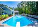 Sparkling backyard pool with diving board and a deck perfect for summer relaxation at 7003 Tara Dr, Villa Rica, GA 30180
