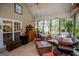Relaxing screened porch with comfortable seating and views of the backyard at 7003 Tara Dr, Villa Rica, GA 30180