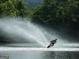 Lake view of a water skier slicing through the water on a sunny day at 7003 Tara Dr, Villa Rica, GA 30180