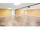 Unfurnished basement with light-colored paint and hardwood floors at 180 Rock Hill Dr, Fayetteville, GA 30215