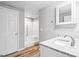 Clean bathroom featuring gray walls, granite countertops, and a white shower at 180 Rock Hill Dr, Fayetteville, GA 30215