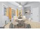 Bright breakfast nook with a round table and bay windows at 180 Rock Hill Dr, Fayetteville, GA 30215