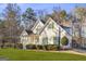 Charming two-story home with a well-manicured lawn and a long driveway at 180 Rock Hill Dr, Fayetteville, GA 30215