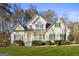 Beautiful two-story home with a well-manicured lawn and lush landscaping at 180 Rock Hill Dr, Fayetteville, GA 30215