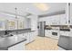 Modern kitchen with stainless steel appliances and ample counter space at 180 Rock Hill Dr, Fayetteville, GA 30215