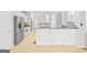 Bright, open kitchen with stainless steel appliances and breakfast bar at 180 Rock Hill Dr, Fayetteville, GA 30215