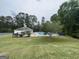 Community pool area features large open grassy area and gazebo at 180 Rock Hill Dr, Fayetteville, GA 30215