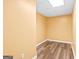 A yellow room with a windowless design, light colored floor and an electrical outlet at 180 Rock Hill Dr, Fayetteville, GA 30215