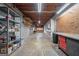 Spacious basement with shelves, workbench, pegboard, and concrete floor offering ample storage and workspace at 185 Downybrook Ln, Fayetteville, GA 30215