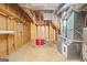 Unfinished basement with exposed wood framing, a utility area, and concrete floor, ready for customization at 185 Downybrook Ln, Fayetteville, GA 30215