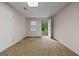 Bright bedroom with a window and an open door leading to the exterior, offering fresh air and natural light at 185 Downybrook Ln, Fayetteville, GA 30215