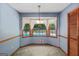 Bright breakfast nook with views of the backyard pool through a bay window, perfect for casual dining at 185 Downybrook Ln, Fayetteville, GA 30215