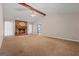 Bright and airy living room with a brick fireplace, ceiling fan, and carpeted floors, ready for Gathering gatherings at 185 Downybrook Ln, Fayetteville, GA 30215