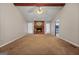 Spacious living room featuring a cozy brick fireplace, ceiling fan, and abundant natural light at 185 Downybrook Ln, Fayetteville, GA 30215