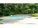 Backyard featuring in-ground pool with diving board, providing a refreshing escape and recreation area at 185 Downybrook Ln, Fayetteville, GA 30215