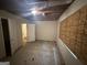 Unfinished basement space ready for renovation with visible ceiling and plywood covered window at 101 Pinetree Trl, Atlanta, GA 30349