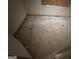 Unfinished basement space ready for renovation with exposed concrete floor and plywood covered window at 101 Pinetree Trl, Atlanta, GA 30349