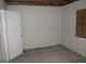 Bedroom featuring an interior door, partially covered window, and damaged walls at 101 Pinetree Trl, Atlanta, GA 30349