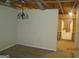 Dining room featuring rustic chandelier and partially finished walls at 101 Pinetree Trl, Atlanta, GA 30349