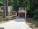 Charming home featuring a convenient one-car garage and a welcoming, extended driveway at 101 Pinetree Trl, Atlanta, GA 30349