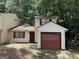 Charming home featuring a one-car garage, with neutral siding and red trim at 101 Pinetree Trl, Atlanta, GA 30349