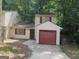 Inviting residence with a convenient attached garage and a private driveway for easy parking at 101 Pinetree Trl, Atlanta, GA 30349
