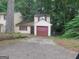 Charming home featuring a one-car garage, with neutral siding and red trim at 101 Pinetree Trl, Atlanta, GA 30349
