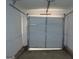 Empty garage with white door at 101 Pinetree Trl, Atlanta, GA 30349