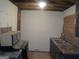 Unfinished kitchen featuring open stud walls, appliances, and double basin sink at 101 Pinetree Trl, Atlanta, GA 30349