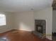 Living room featuring a stone fireplace, tile floors, and natural light at 101 Pinetree Trl, Atlanta, GA 30349