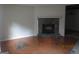 Living room featuring a stone fireplace, tile floors, and open access to dining room at 101 Pinetree Trl, Atlanta, GA 30349