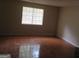 Inviting living space featuring a window and tiled flooring, offering a cozy ambiance at 101 Pinetree Trl, Atlanta, GA 30349