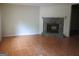 Cozy living room featuring a classic stone fireplace and tile flooring, perfect for relaxation at 101 Pinetree Trl, Atlanta, GA 30349