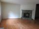 Welcoming living room space featuring a stone fireplace and tile flooring, creating a comfortable atmosphere at 101 Pinetree Trl, Atlanta, GA 30349