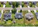 An aerial view of the home showcasing the roof, lawn, mature trees, and fenced-in backyard at 1209 Polk Xing, Mcdonough, GA 30252