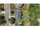 An aerial view of the home showcasing the roof, lawn, mature trees, and fenced-in backyard at 1209 Polk Xing, Mcdonough, GA 30252