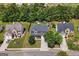 Aerial view showcases the home's location, curb appeal, and well-manicured lawn at 1209 Polk Xing, Mcdonough, GA 30252